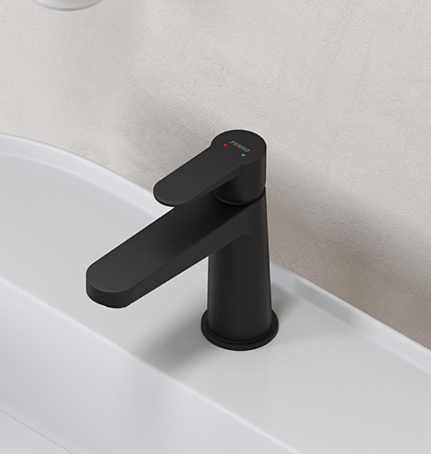 Czarna, nowoczesna bateria umywalkowa Nostris zamontowana na białej umywalce