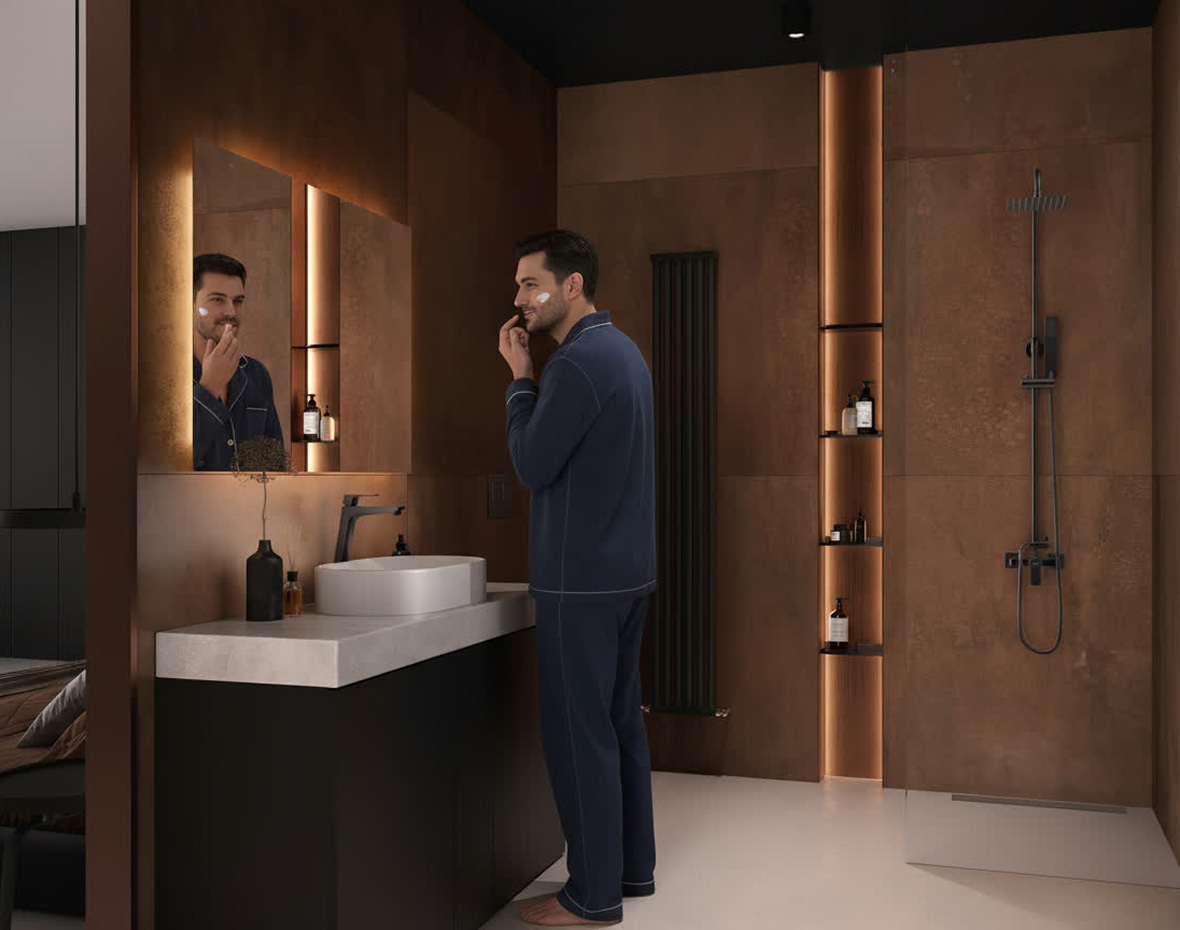 Mężczyzna w piżamie goli się w luksusowej łazience z brązowymi kafelkami i nowoczesnym wystrojem.
